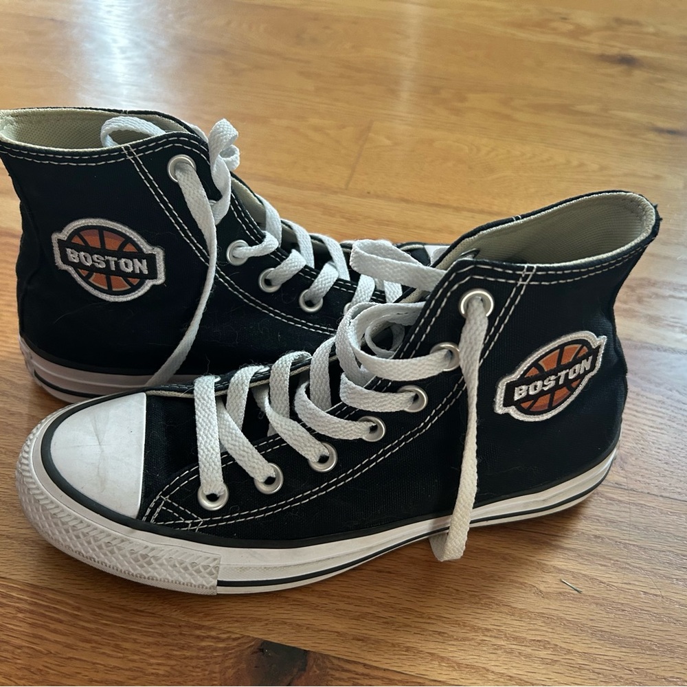 Customized high top black converse with Boston Basketball patch on both shoes
